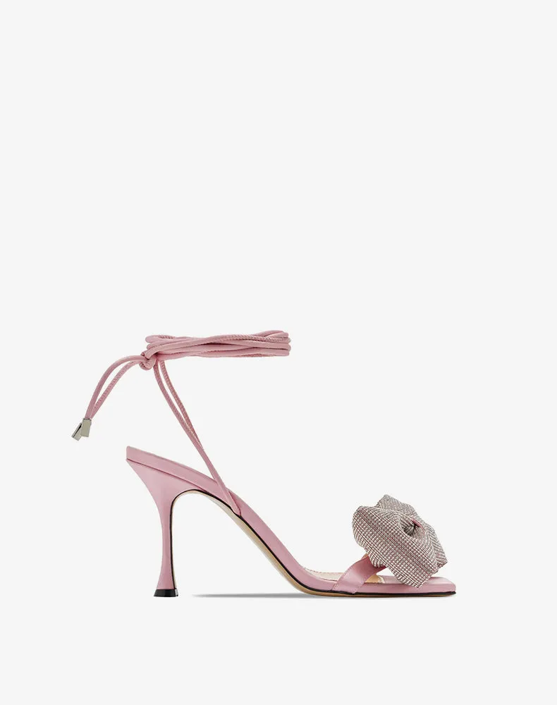 Early spring sandals feature a fine heel, an open toe, and a lace-up- Poli